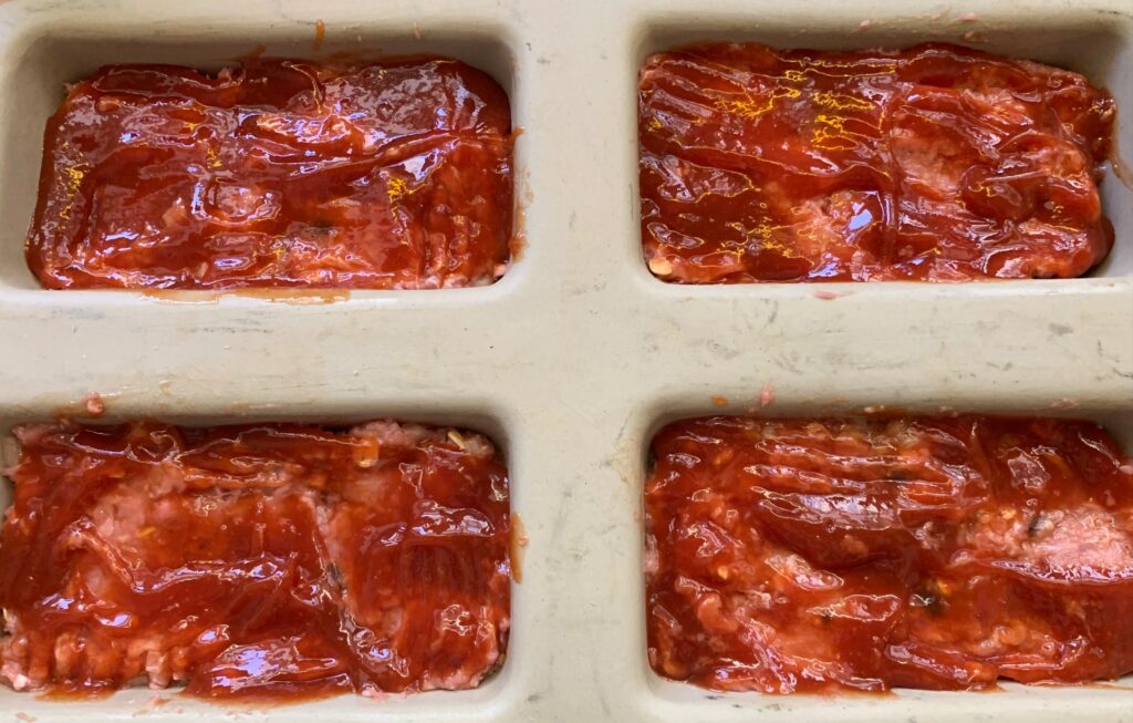meatloaf cooked in a stoneware loaf pan