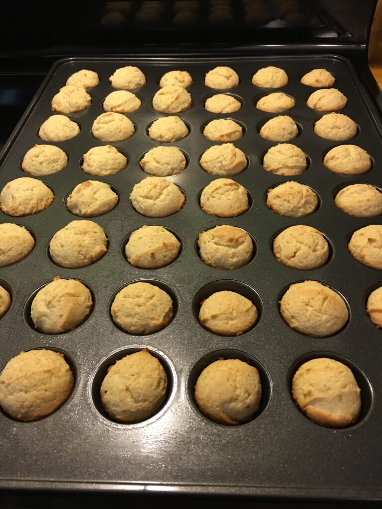 Mini muffin pan coming out of the oven