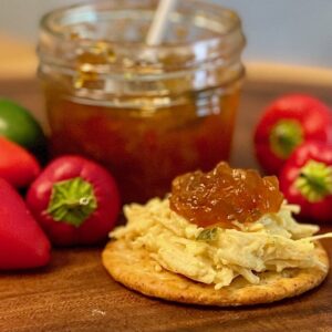 pepper jelly jar and cracker with chicken salad and jelly