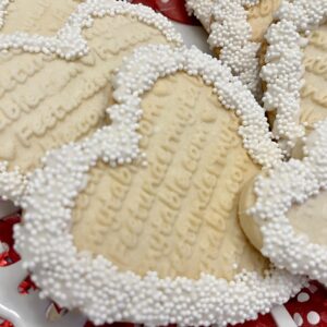 Close up of Embossed Valentine Cookies with white sprinkles
