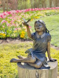 Bronze girl on lawn at Gibbs Garden