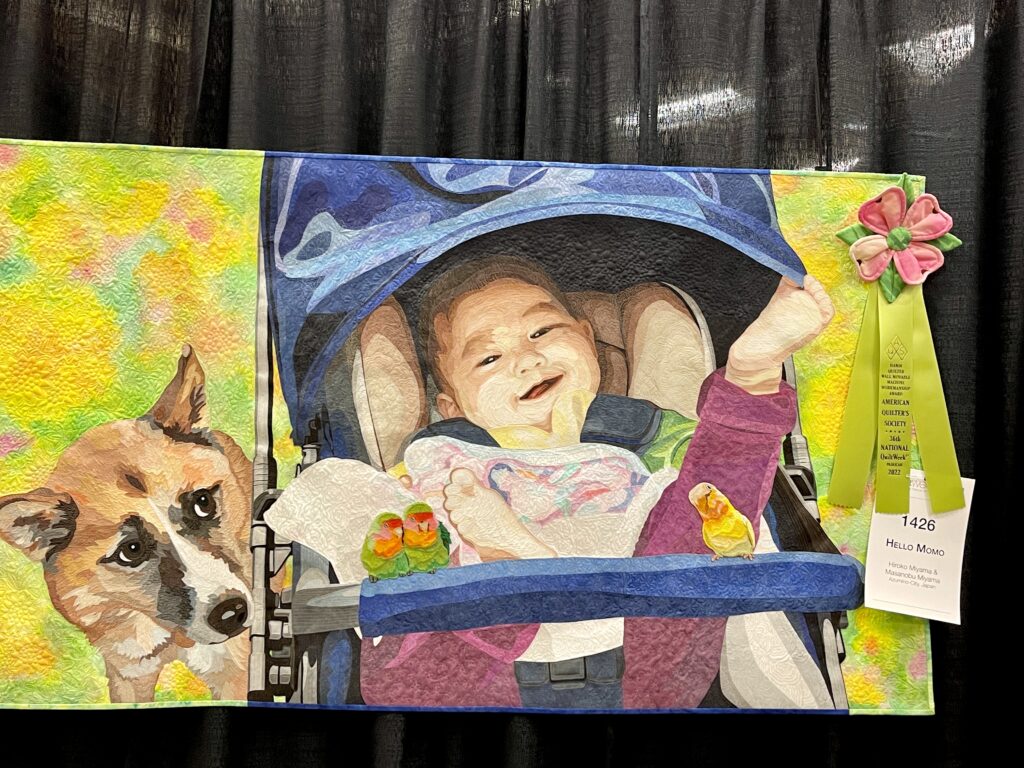 Baby in stroller with dog quilt 