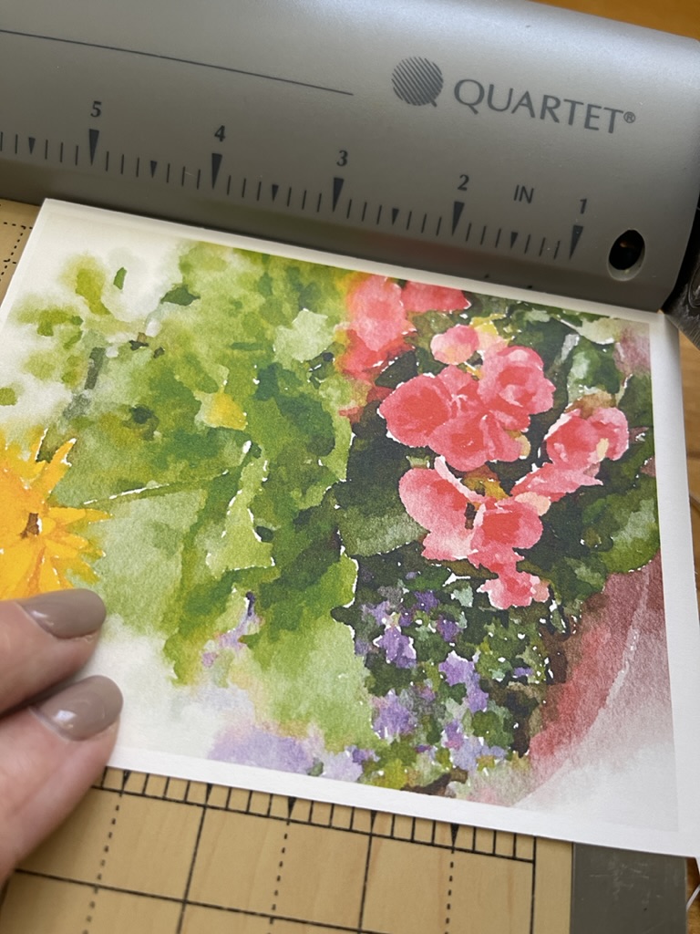 cutting watercolor card on paper cutter for gift tag