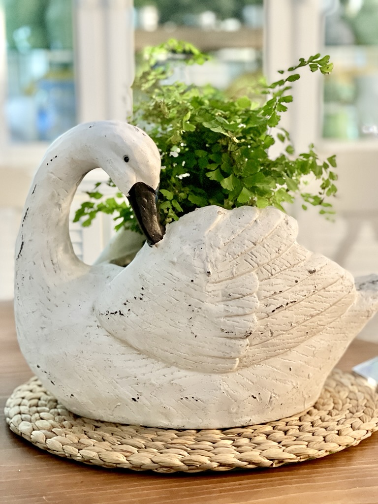 swan centerpiece with fern for table setting