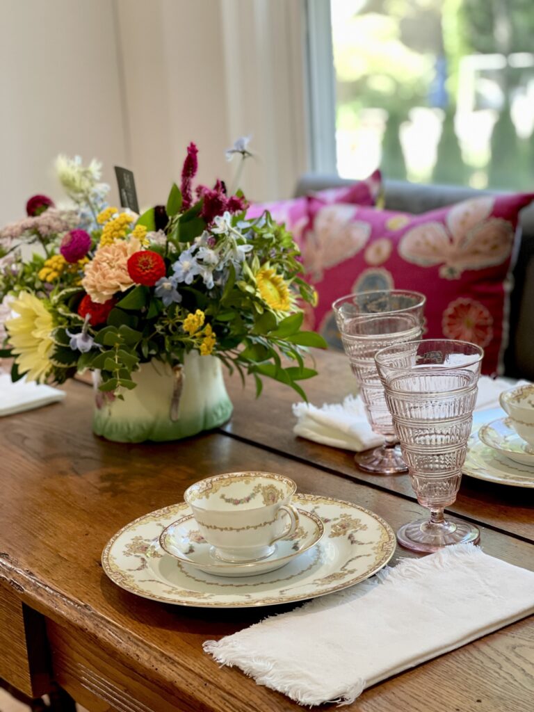 Dining table with fresh flowers and china