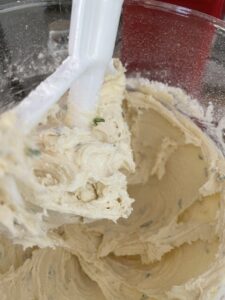 adding flour into dough