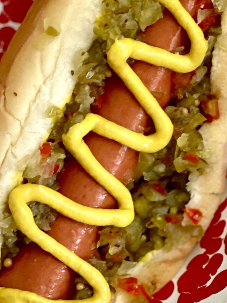 hot dog with mustard and pickle relish