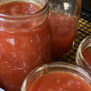 open jars of homemade ketchup