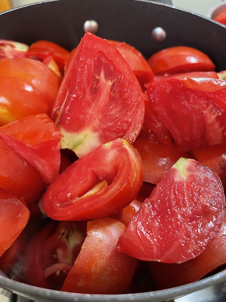cut tomatoes in pot
