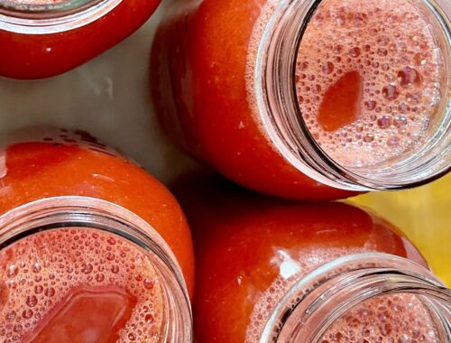 overhead view of filled tomato juice jar