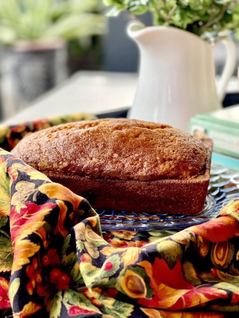 loaf of pumpkin bread with towel