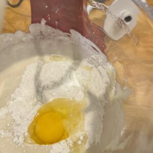 Adding egg and flour to yeast bread dough