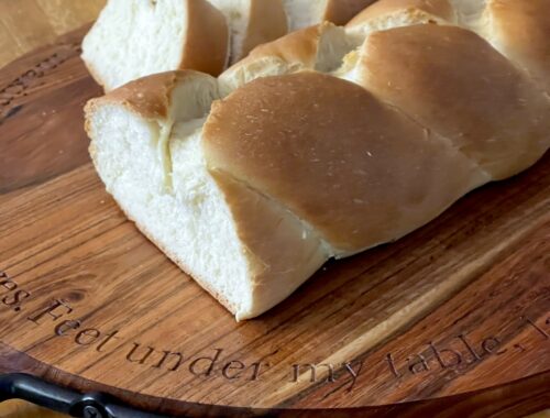 Braided bread on wooden board
