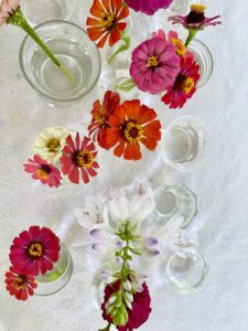 adding cut flowers to vases