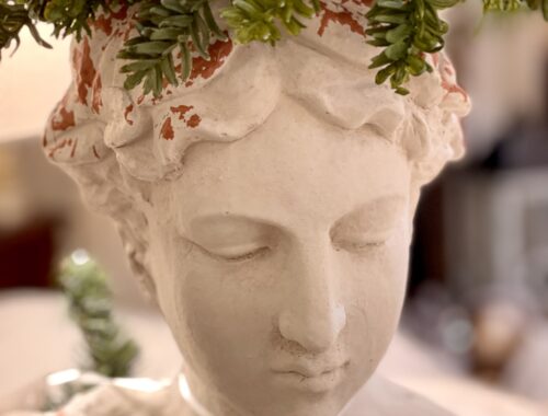 Head statue with pine cone head decor