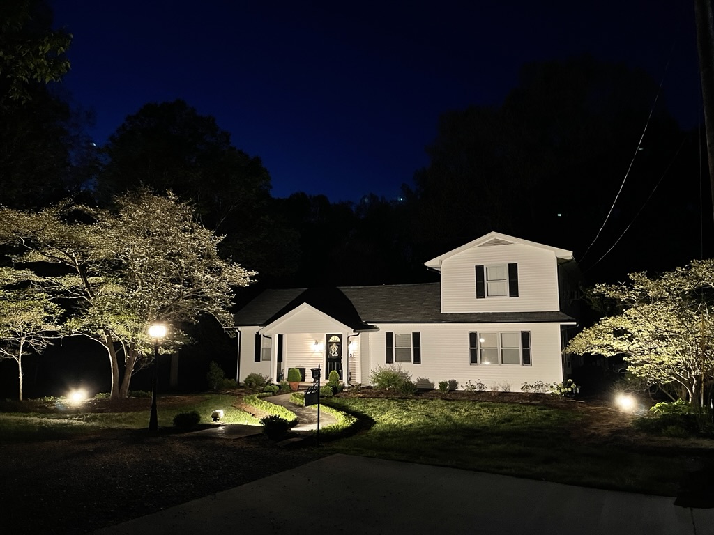 night view of home with Dogwoods in bloom