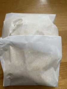 lemon shortbread dough wrapped in parchment paper