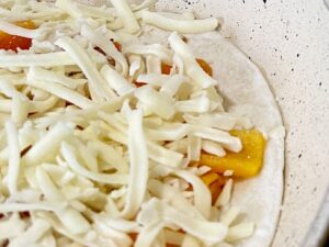 cheese added to vegetable quesadilla