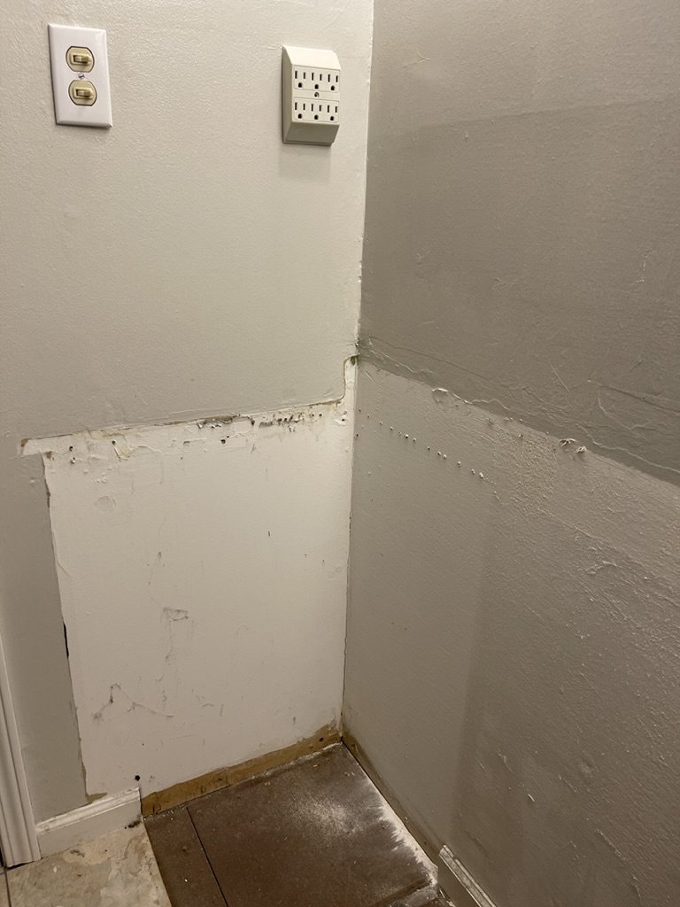 wall behind cabinets in bathroom remodel