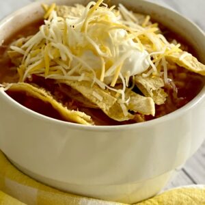 Taco soup recipe in bowl with toppings