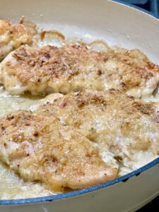 Cooked Parmesan chicken in pan