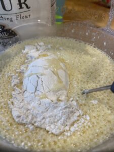 Mixing crepe batter for chicken crepes