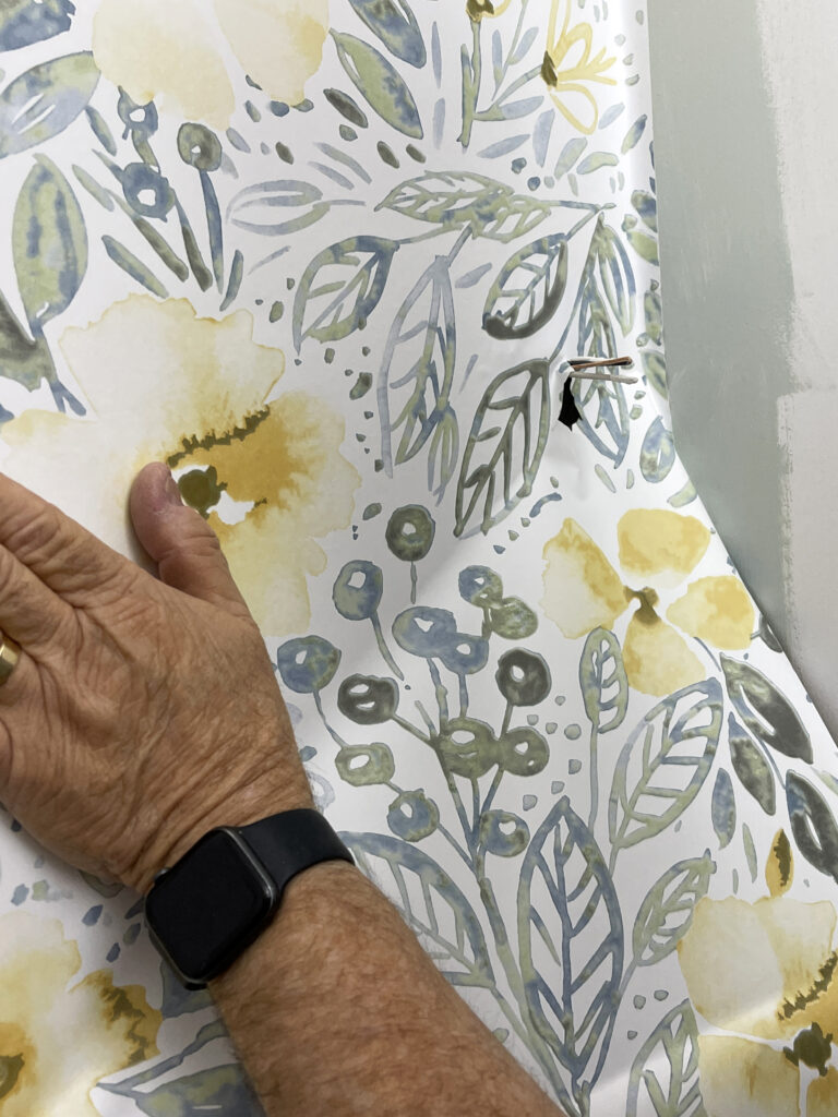 retouched hand on peel and stick wallpaper