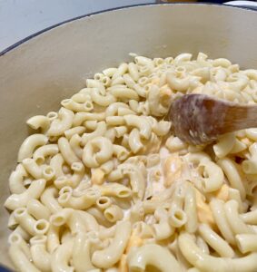 adding cheese to macaroni and cheese recipe