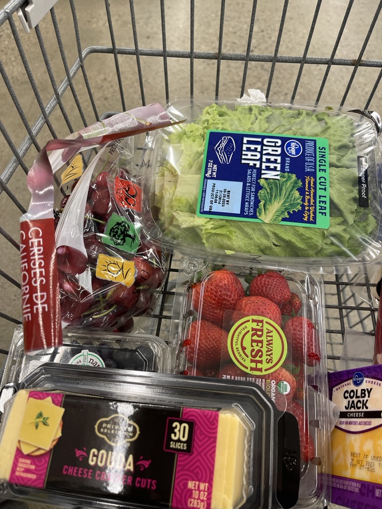 grocery cart with charcuterie items