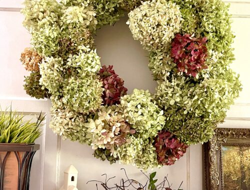 fall hydrangea wreath hung on mantel