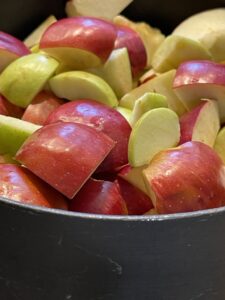 Cut apples for applesauce added to nonstick stock pot