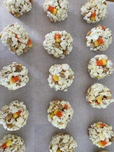 parchment paper filled with candy corn popcorn balls