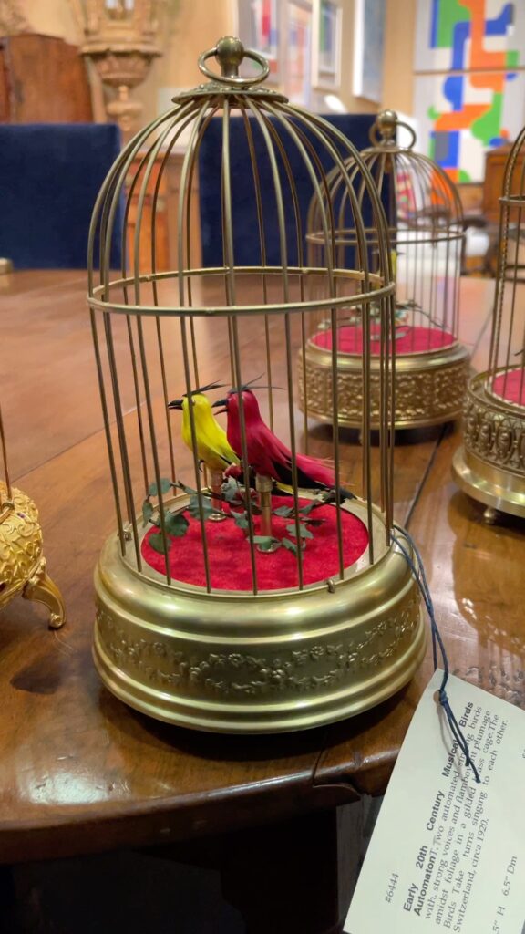 European singing birds in golden cage