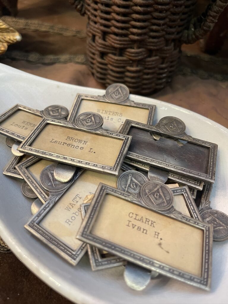 silver name tags at Nashville Antiques and Garden show 2024