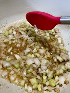 cooking butter, celery, onion and seasonings for chicken pot pie