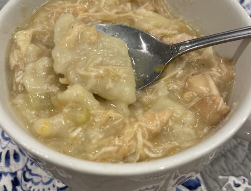 gluten free chicken and dumplings in a bowl with a spoon