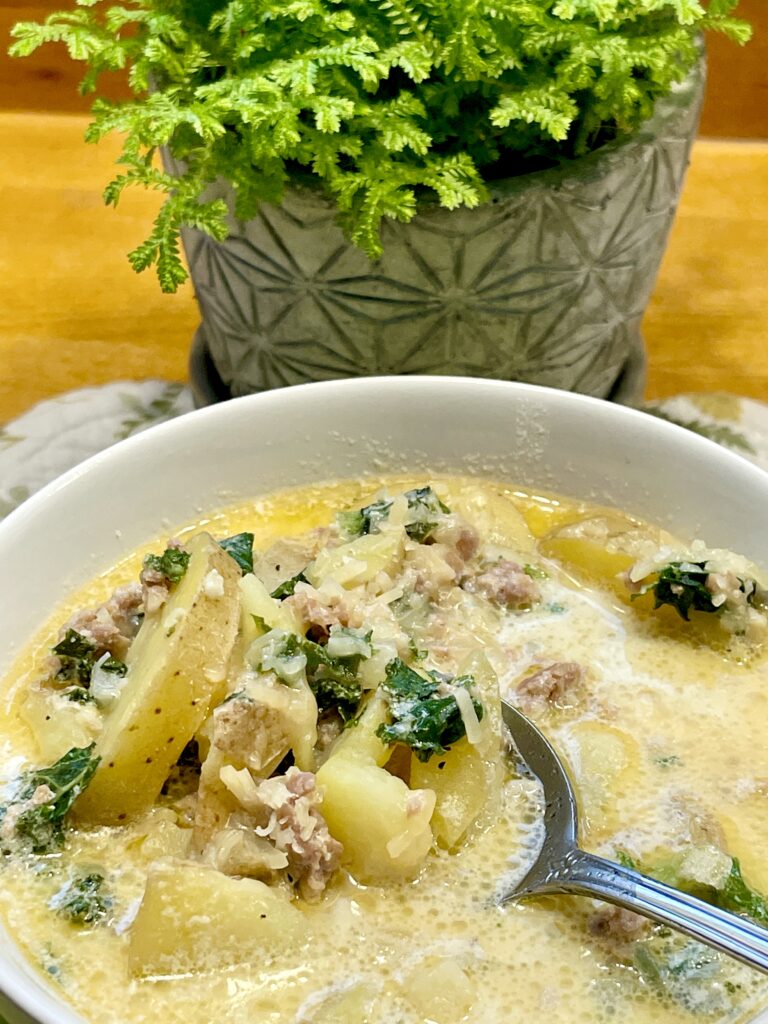 bowl of toscano soup with spoon