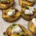 baked potato skins with cheese, bacon, sour cream and green onions added