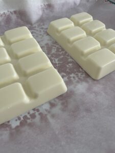 white chocolate added to baking sheet for Easter white chocolate almond bark candy
