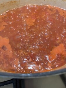 tomato basil soup cooking in pot