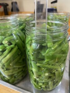 remove air from canning jars with nonmetallic canning tool