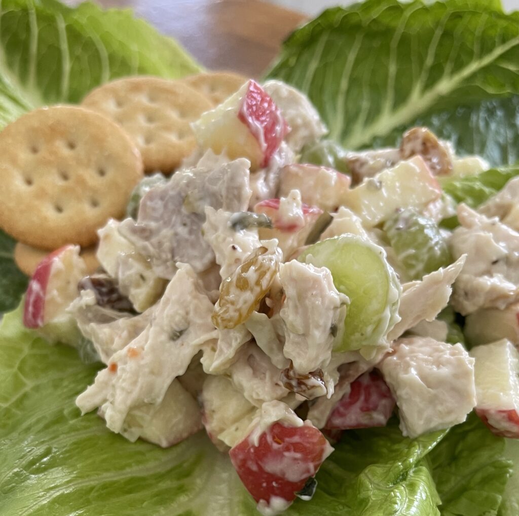 sweet rotisserie chicken salad on a lettuce leaf