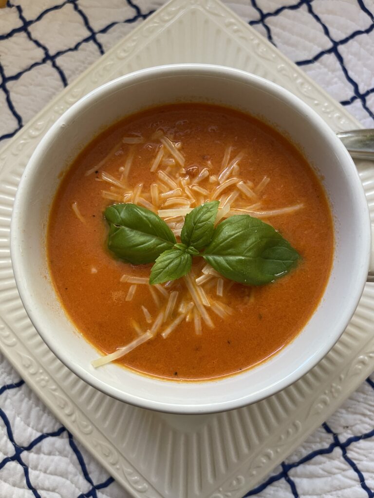 overhead photo of creamy tomato basil soup