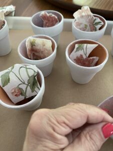 Add cut napkins to fit pots inside of pots before beginning Mod Podge