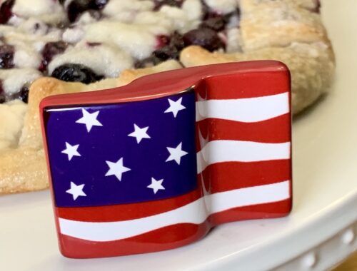 blueberry galette on patriotic cake stand