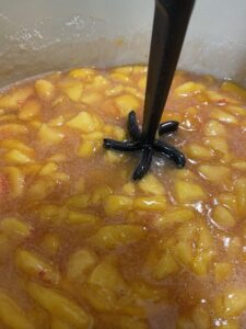 chopping peaches for peach jam