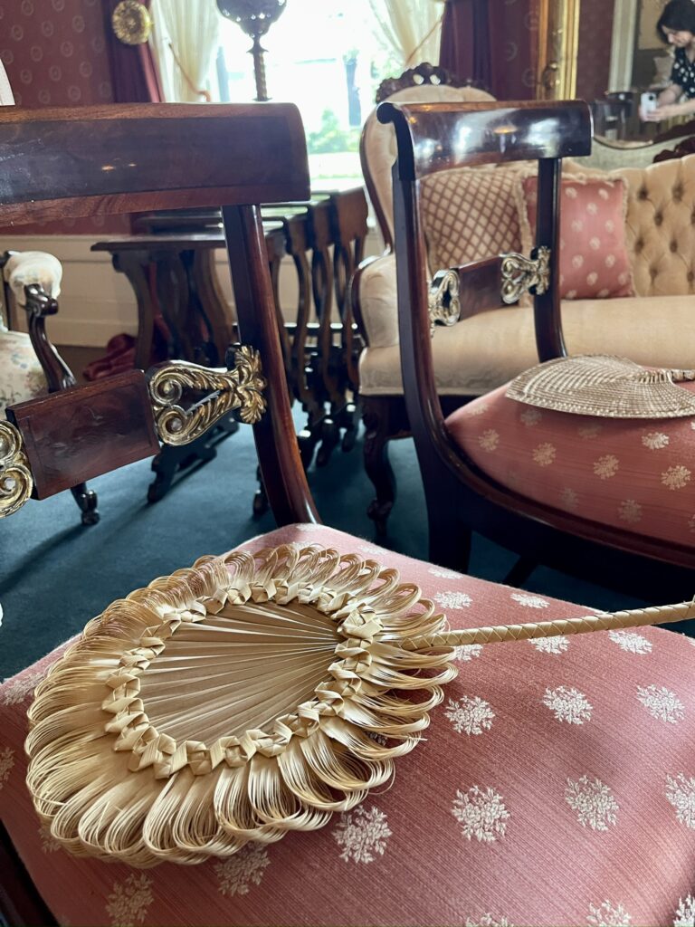 Victorian fans on chairs for the wedding