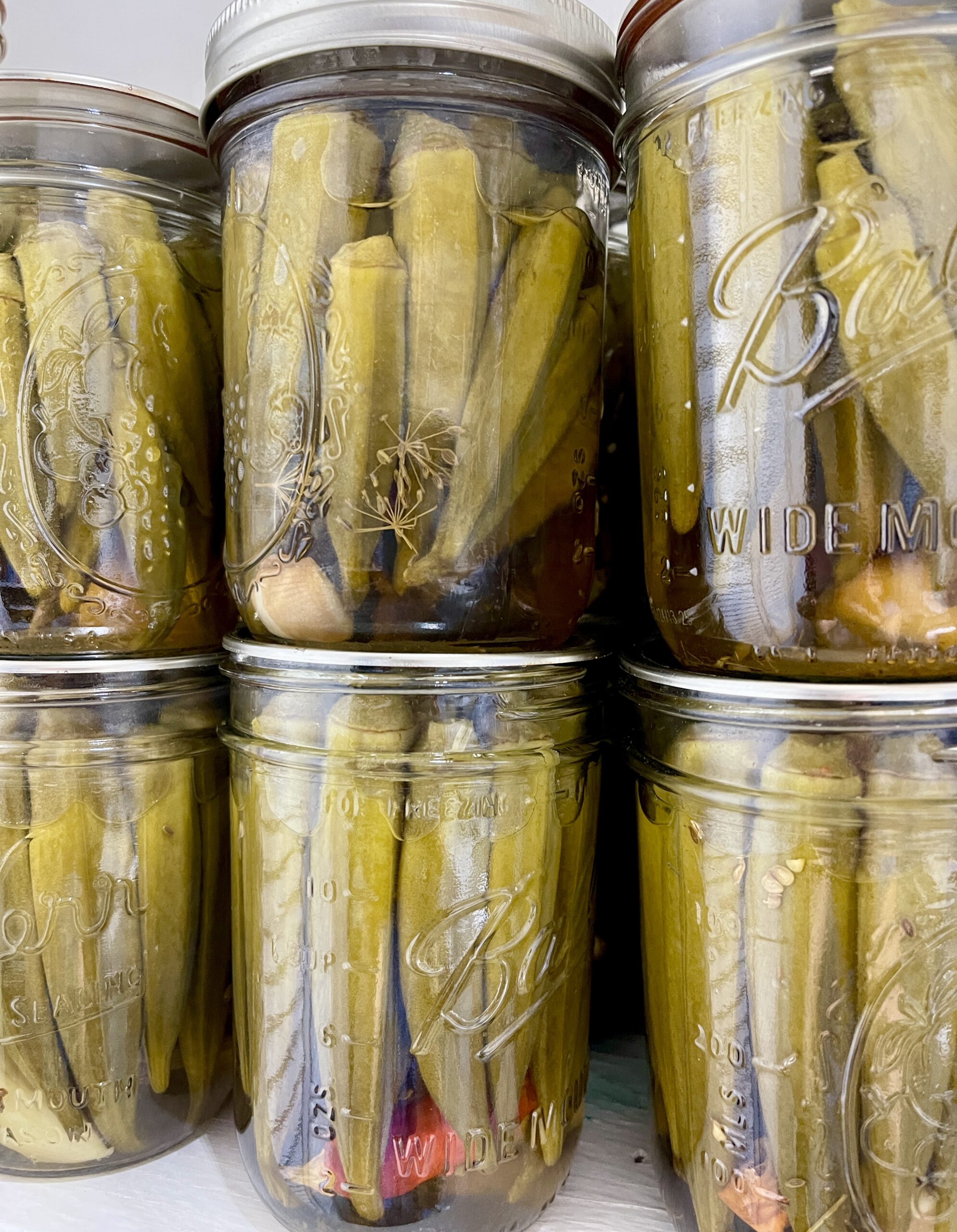 jars of pickled okra in the pantry