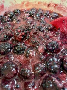cooking blackberries with sugar for blackberry jam