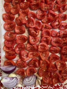 roasted tomato sauce vegetables added to baking sheet